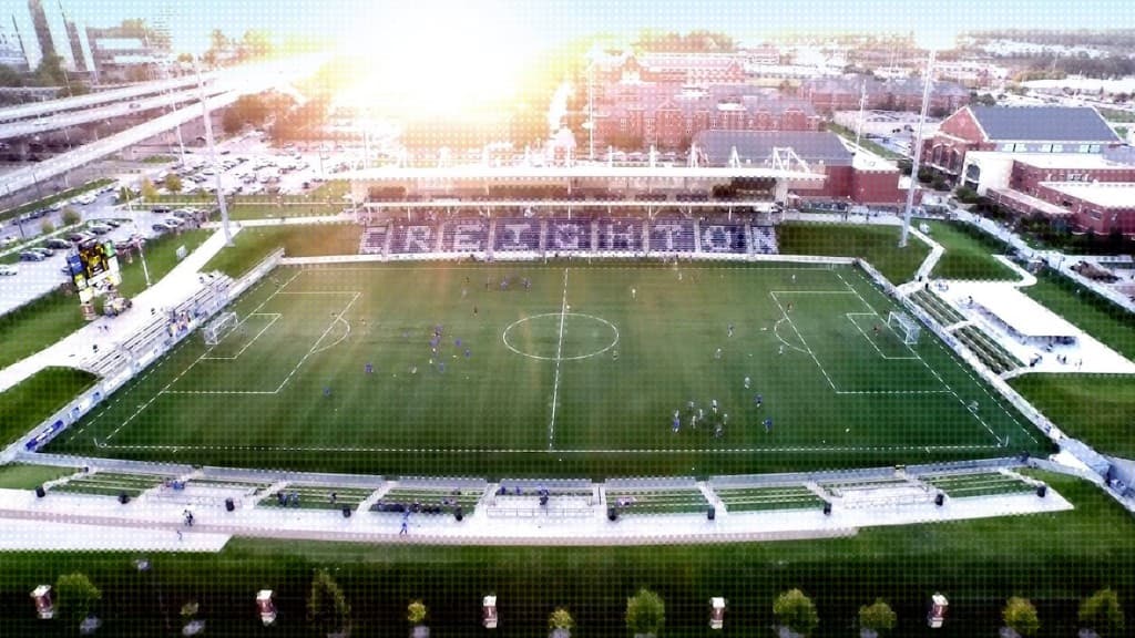 Aerial view of a stadium at dusk